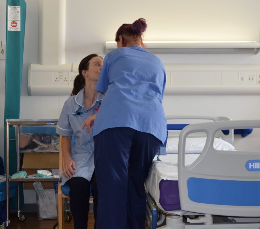An image depicting staff re-enacting a controversial patient handling activity.